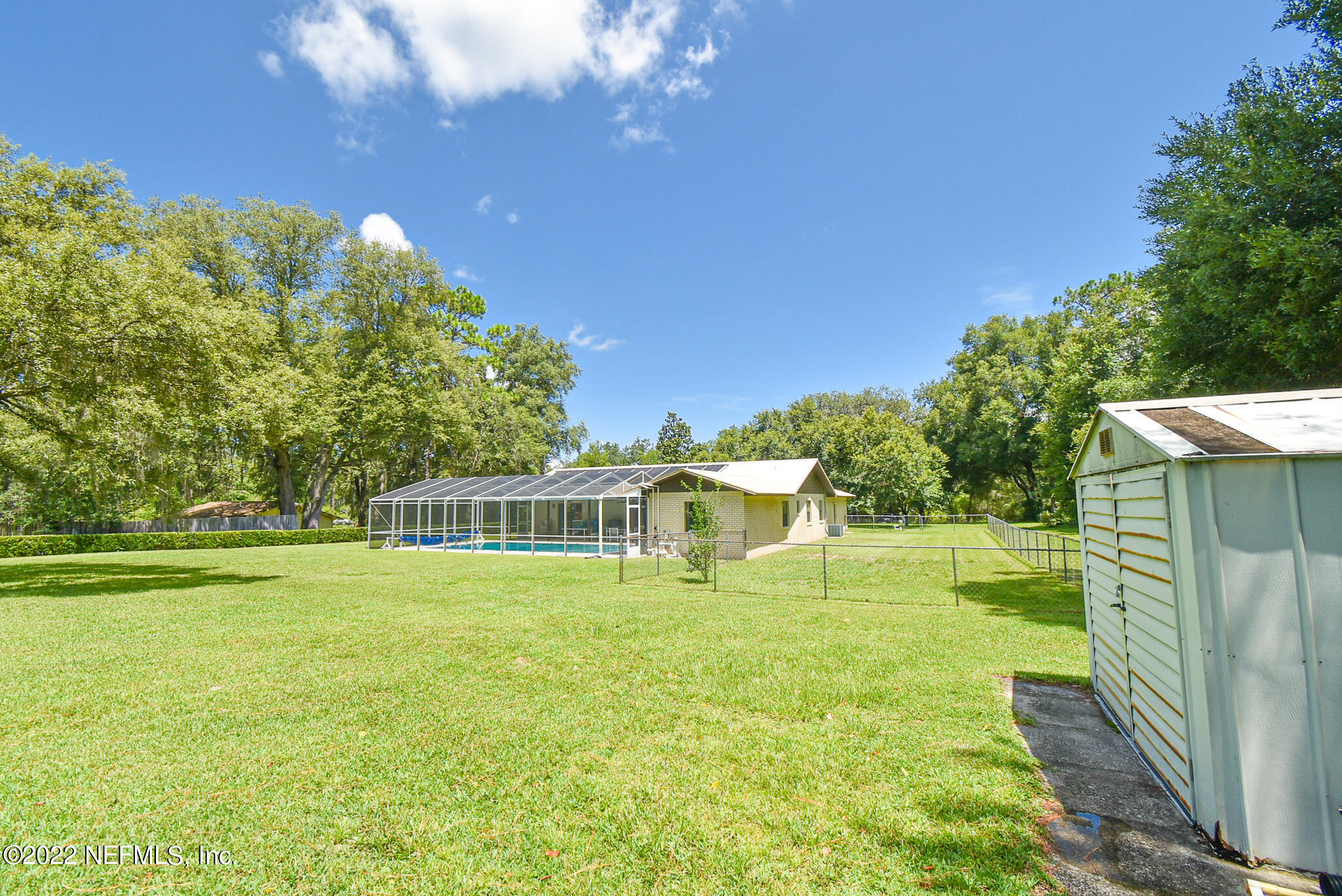 105 Tallow Road Pomona Park, FL 32181 - Photo 49 of 55 a view of a swimming pool with a yard