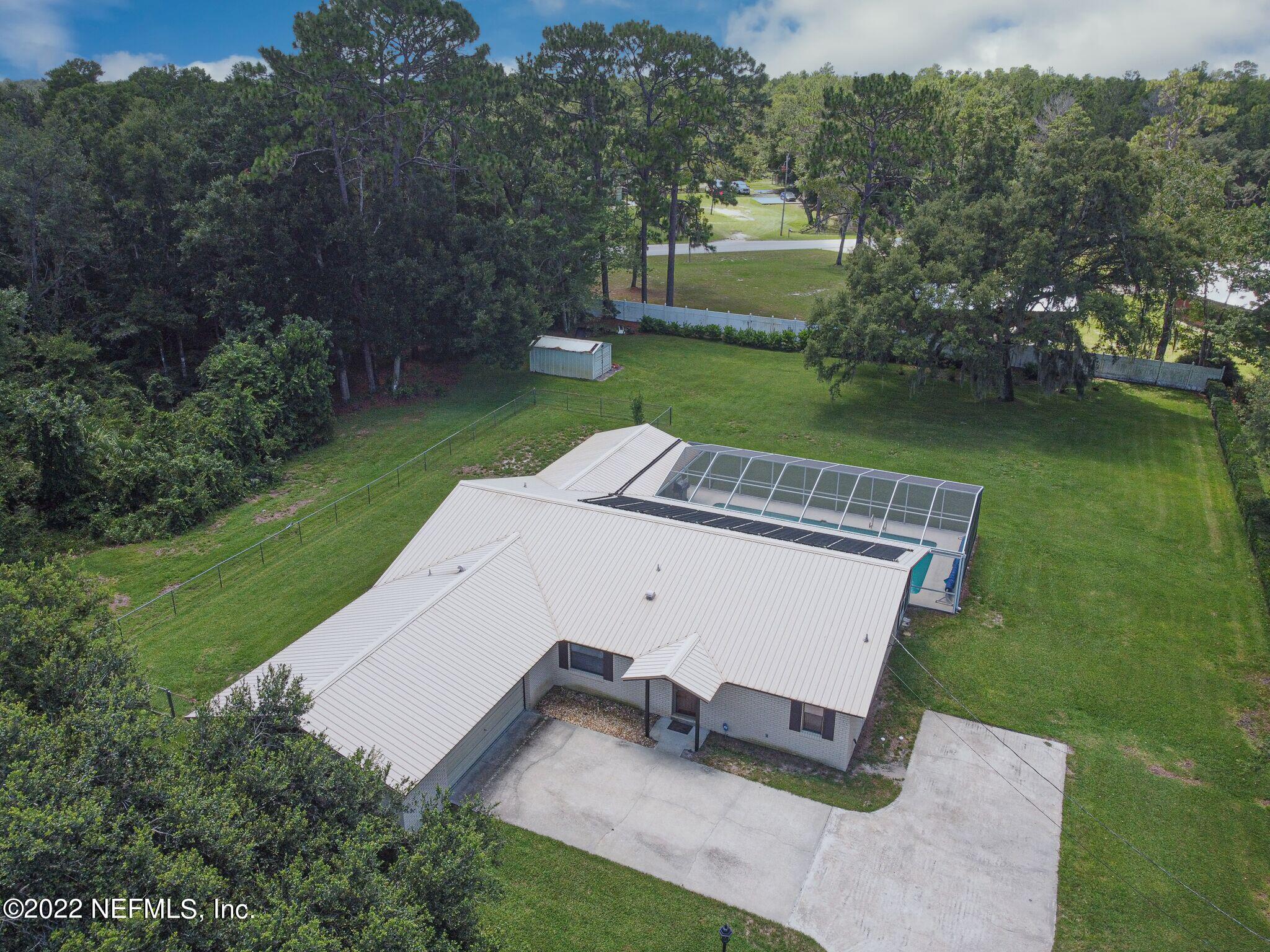 105 Tallow Road Pomona Park, FL 32181 - Photo 55 of 55 an aerial view of a house having yard