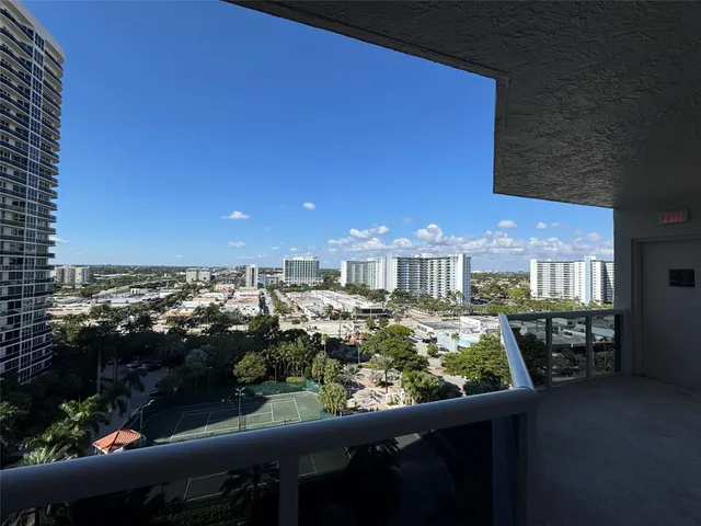an aerial view of a house with garden space and lake view