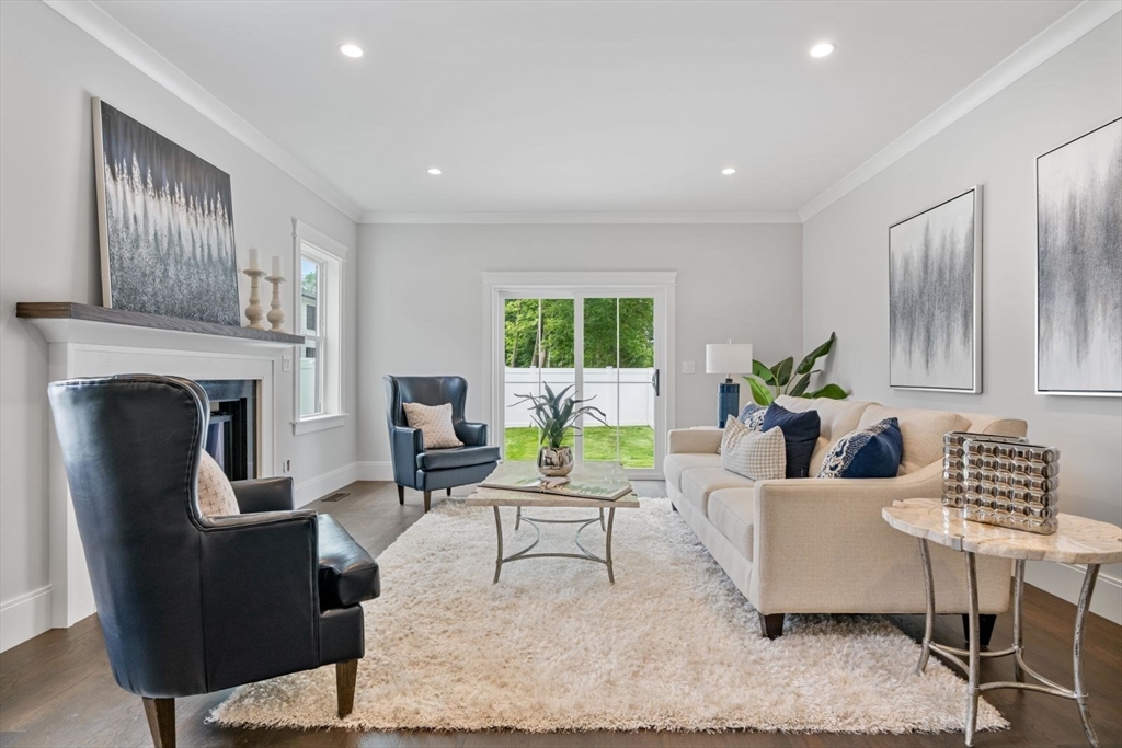 5 Milk Street Natick, MA 01760 - Photo 11 of 36 a living room with furniture and a fireplace