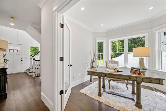 a workspace with furniture and a wooden floor