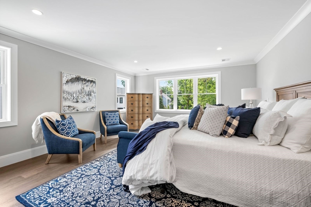 5 Milk Street Natick, MA 01760 - Photo 19 of 36 a bed room with a bed and a chair