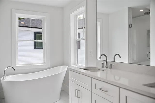 a bathroom with a bathtub and a sink