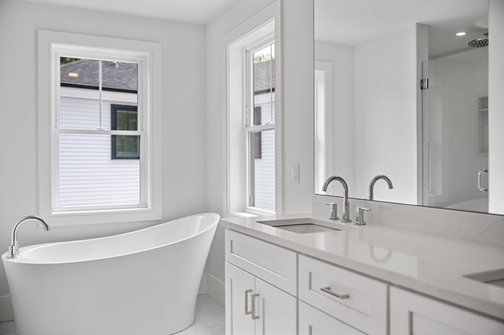 5 Milk Street Natick, MA 01760 - Photo 23 of 36 a bathroom with a bathtub and a sink