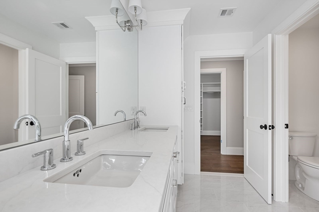 5 Milk Street Natick, MA 01760 - Photo 25 of 36 a bathroom with a sink and a mirror
