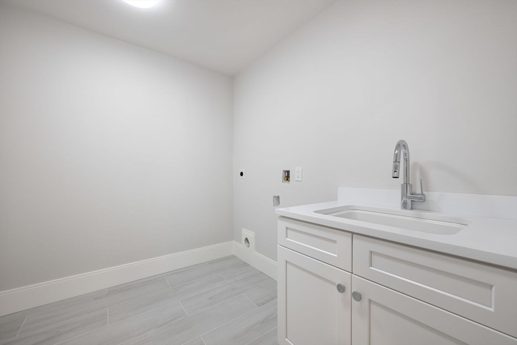 5 Milk Street Natick, MA 01760 - Photo 30 of 36 a bathroom with a sink and vanity