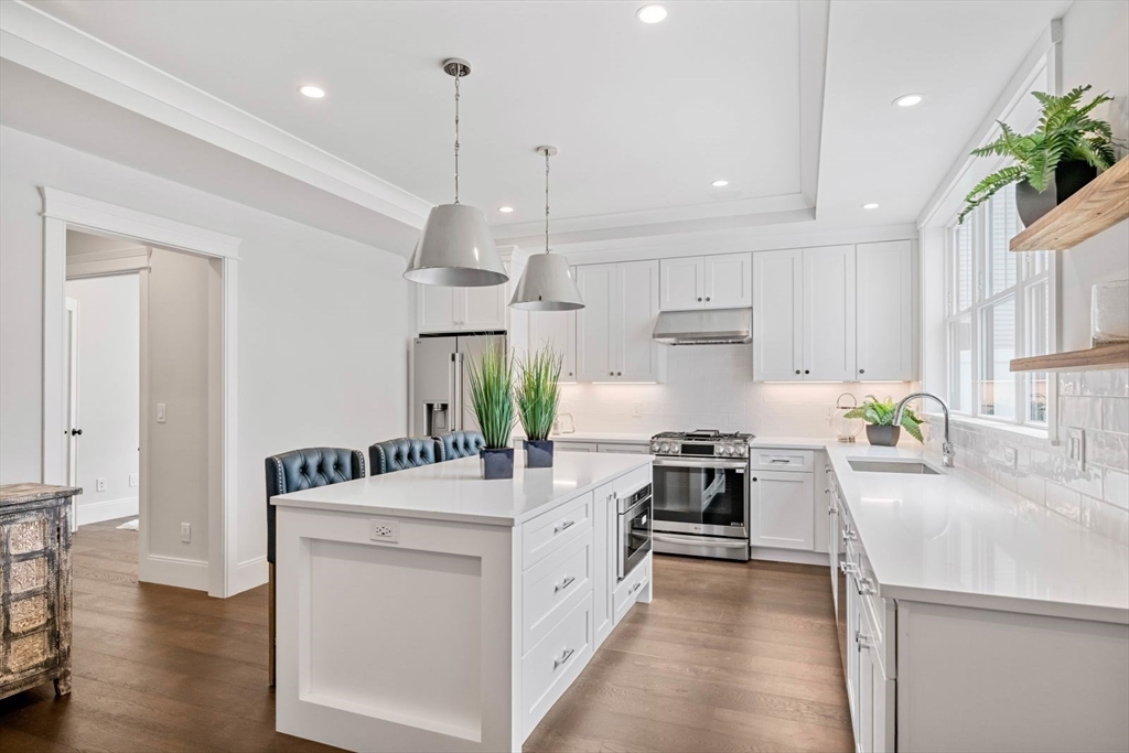 5 Milk Street Natick, MA 01760 - Photo 3 of 36 a large white kitchen with a stove and refrigerator