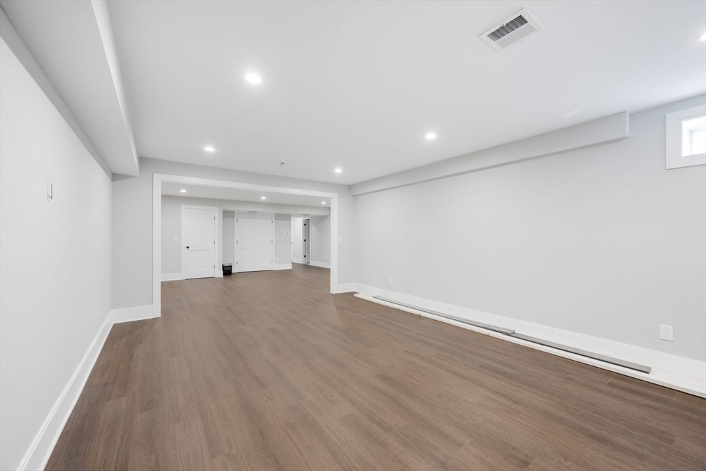 5 Milk Street Natick, MA 01760 - Photo 32 of 36 a view of empty room with wooden floor