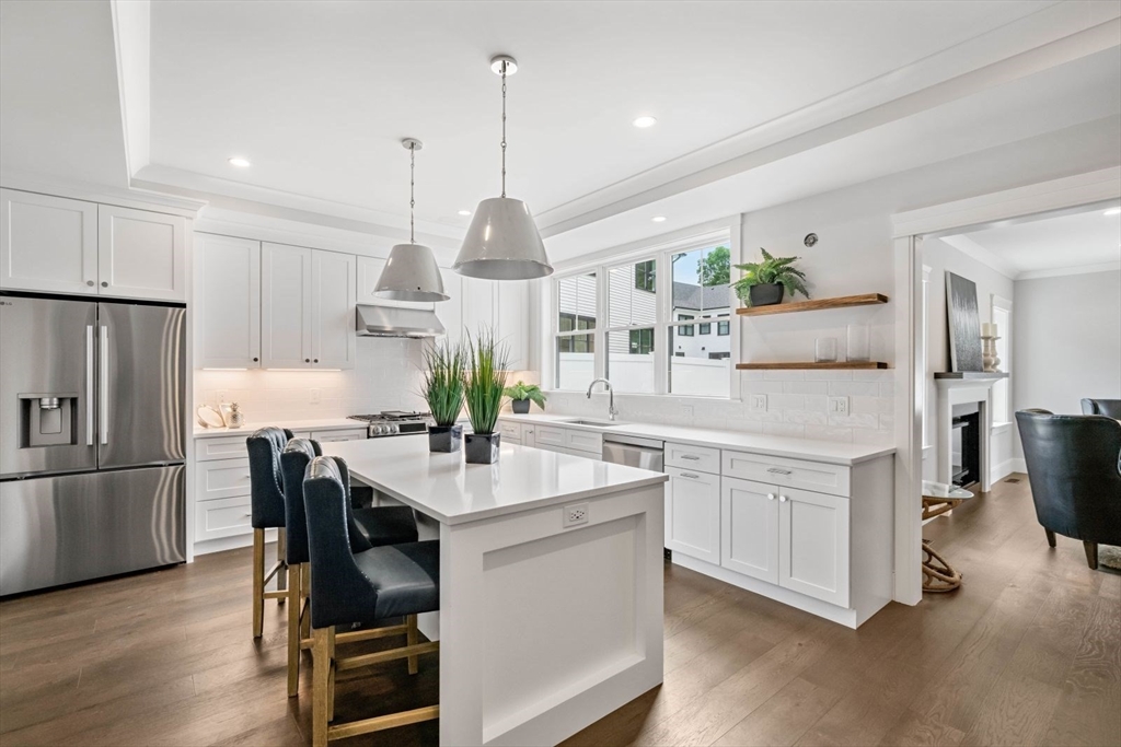 5 Milk Street Natick, MA 01760 - Photo 5 of 36 a kitchen with kitchen island a counter top space appliances and cabinets
