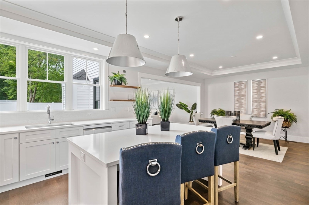 5 Milk Street Natick, MA 01760 - Photo 6 of 36 a view of a kitchen with kitchen island granite countertop furniture and a large window