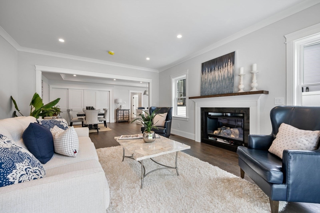 5 Milk Street Natick, MA 01760 - Photo 9 of 36 a living room with furniture fireplace and window