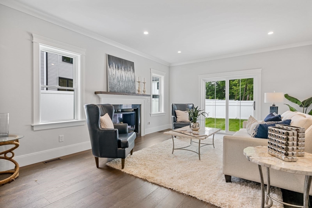 5 Milk Street Natick, MA 01760 - Photo 10 of 36 a living room with furniture and a fireplace