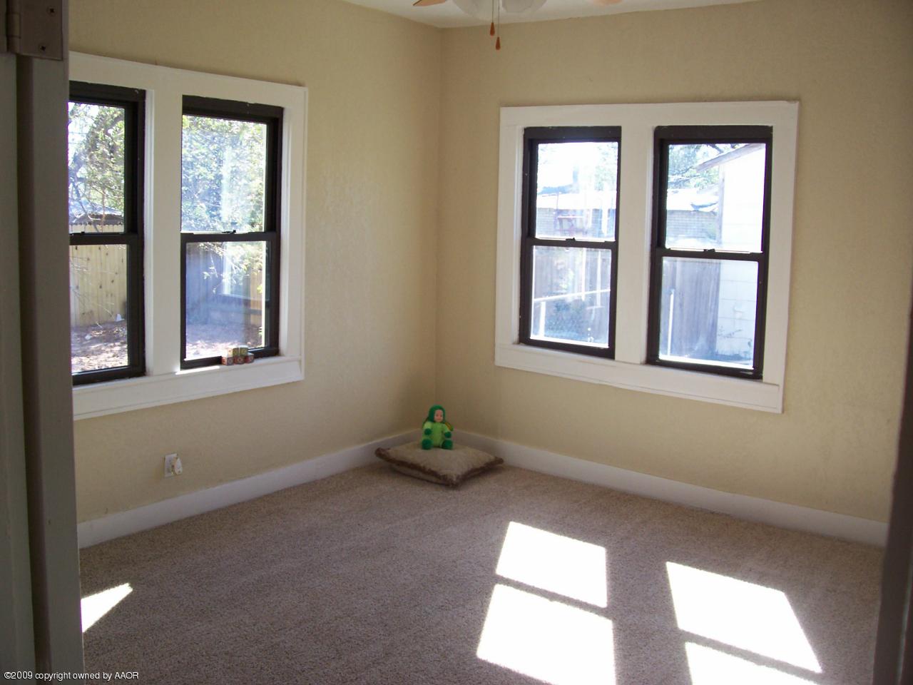 3901 South Polk Street Amarillo, TX 79110 - Photo 3 of 8 a view of an empty room with a window