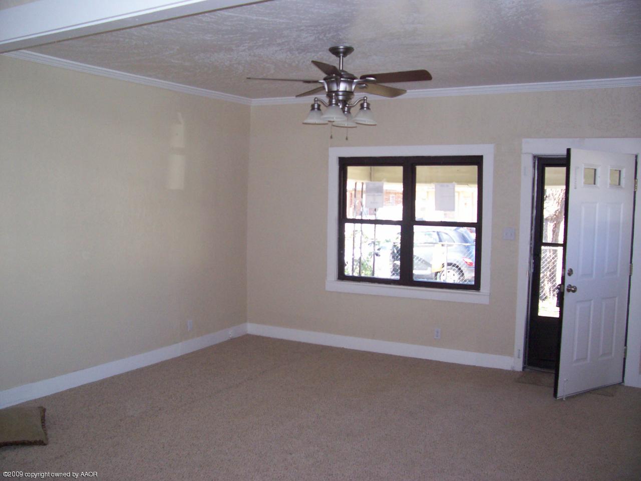 3901 South Polk Street Amarillo, TX 79110 - Photo 8 of 8 an empty room with a window