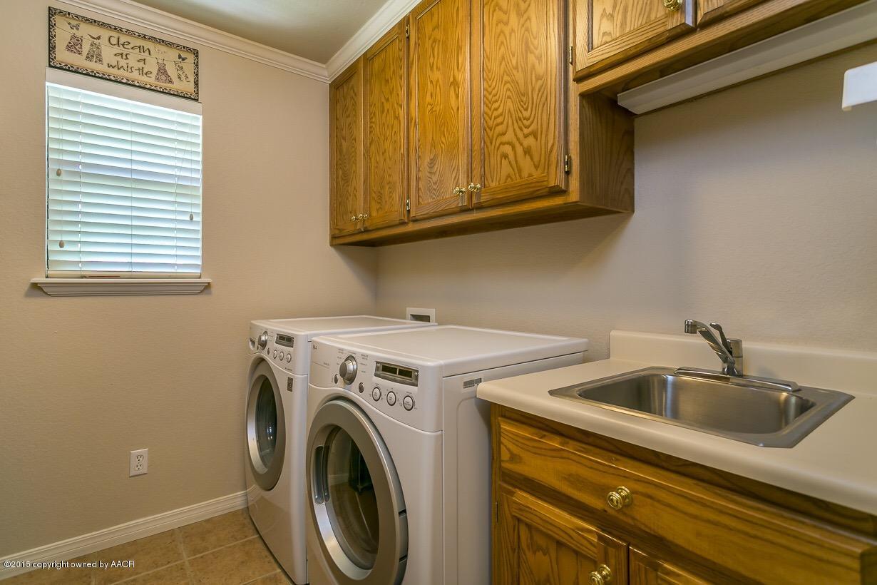 525 Fox Ridge Road Amarillo, TX 79118 - Photo 29 of 29 a utility room with dryer and washer