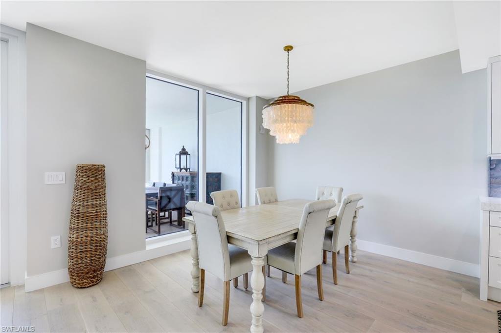 13915 Old Coast Road, Unit 502 Naples, FL 34110 - Photo 9 of 42 a view of a dining room with furniture