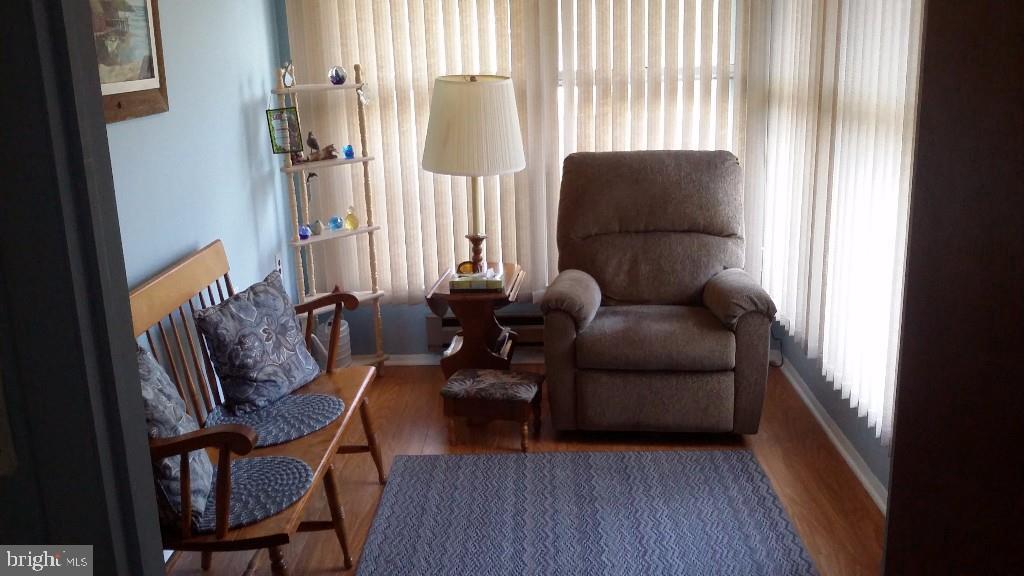 18 A Sycamore Access Road, Unit 5B Manahawkin, NJ 08050 - Photo 2 of 19 a living room with furniture and a window