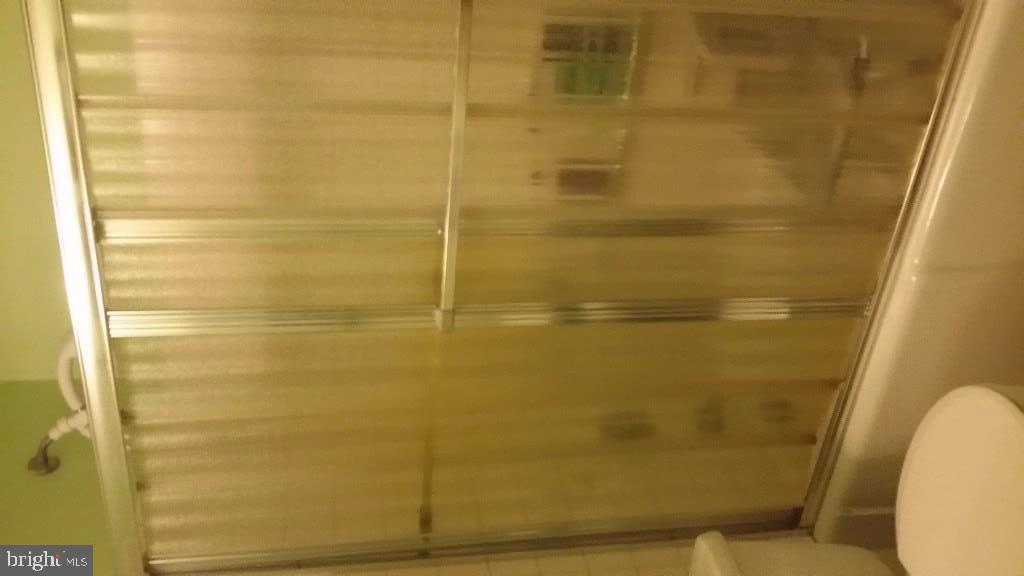 18 A Sycamore Access Road, Unit 5B Manahawkin, NJ 08050 - Photo 15 of 19 a bathroom with a shower