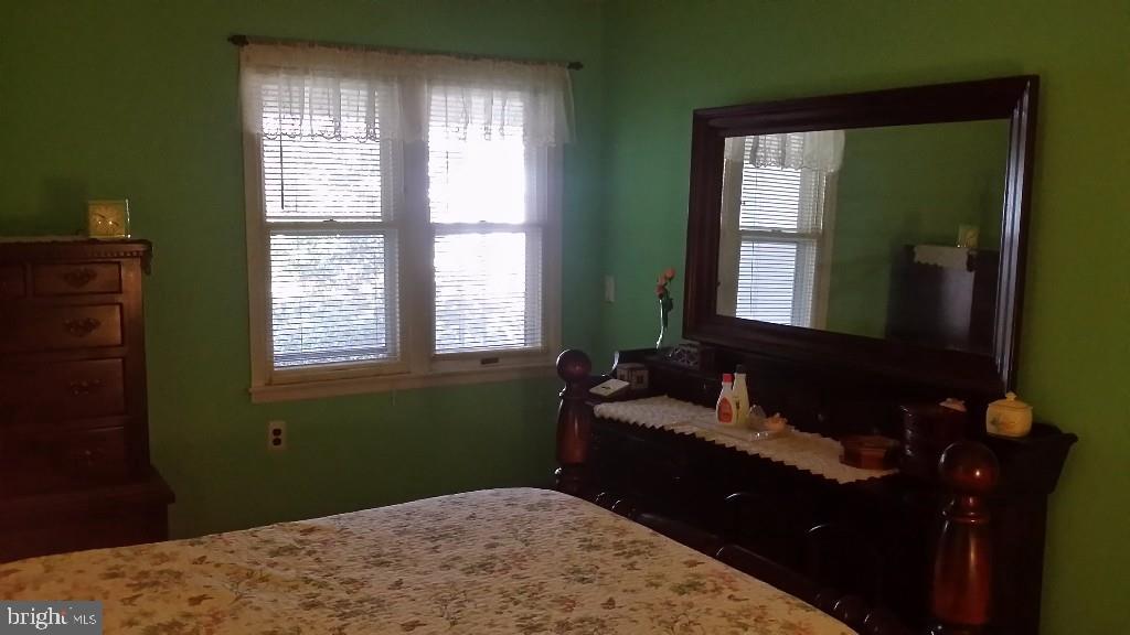 18 A Sycamore Access Road, Unit 5B Manahawkin, NJ 08050 - Photo 17 of 19 a bedroom with a bed and windows