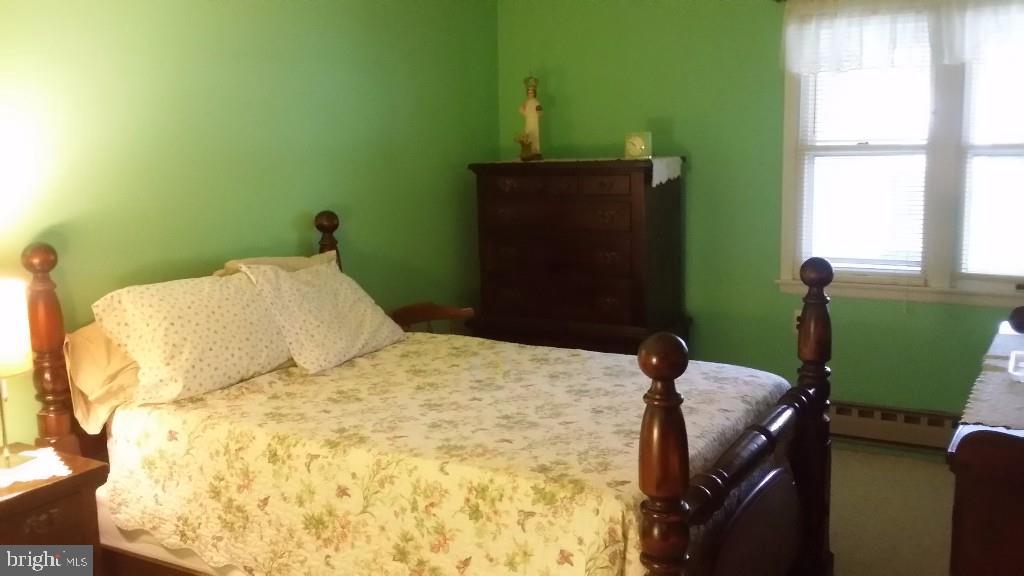 18 A Sycamore Access Road, Unit 5B Manahawkin, NJ 08050 - Photo 19 of 19 a bedroom with a bed and window
