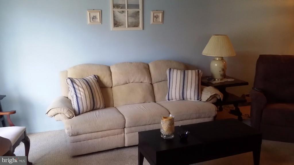 18 A Sycamore Access Road, Unit 5B Manahawkin, NJ 08050 - Photo 4 of 19 a living room with furniture and a lamp