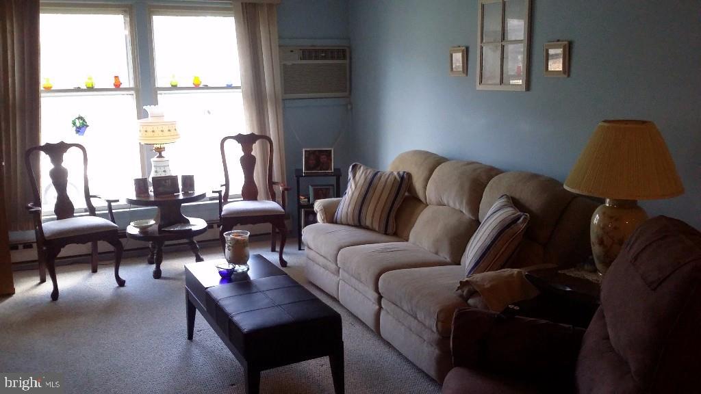 18 A Sycamore Access Road, Unit 5B Manahawkin, NJ 08050 - Photo 5 of 19 a living room with furniture and a window