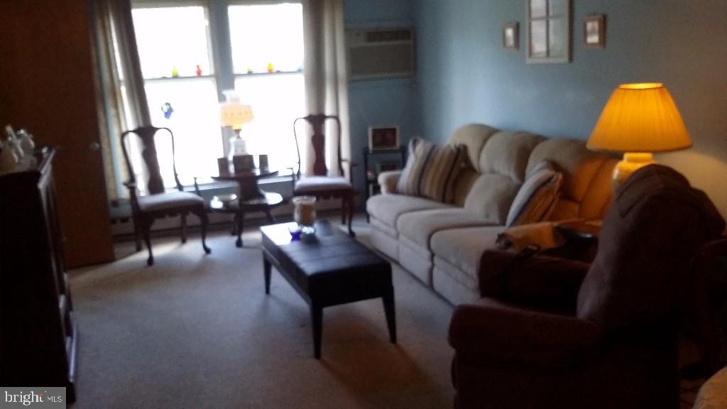 18 A Sycamore Access Road, Unit 5B Manahawkin, NJ 08050 - Photo 6 of 19 a living room with furniture and a window