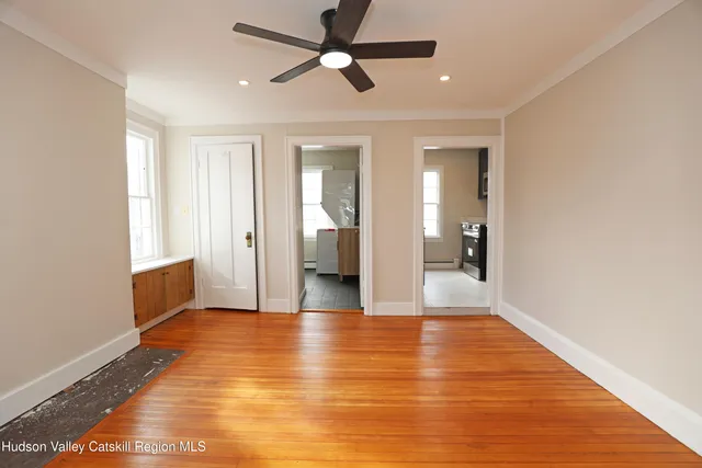 a view of an empty room with a window