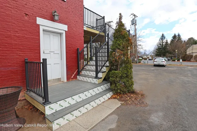 a view of a house with a floor to ceiling windows
