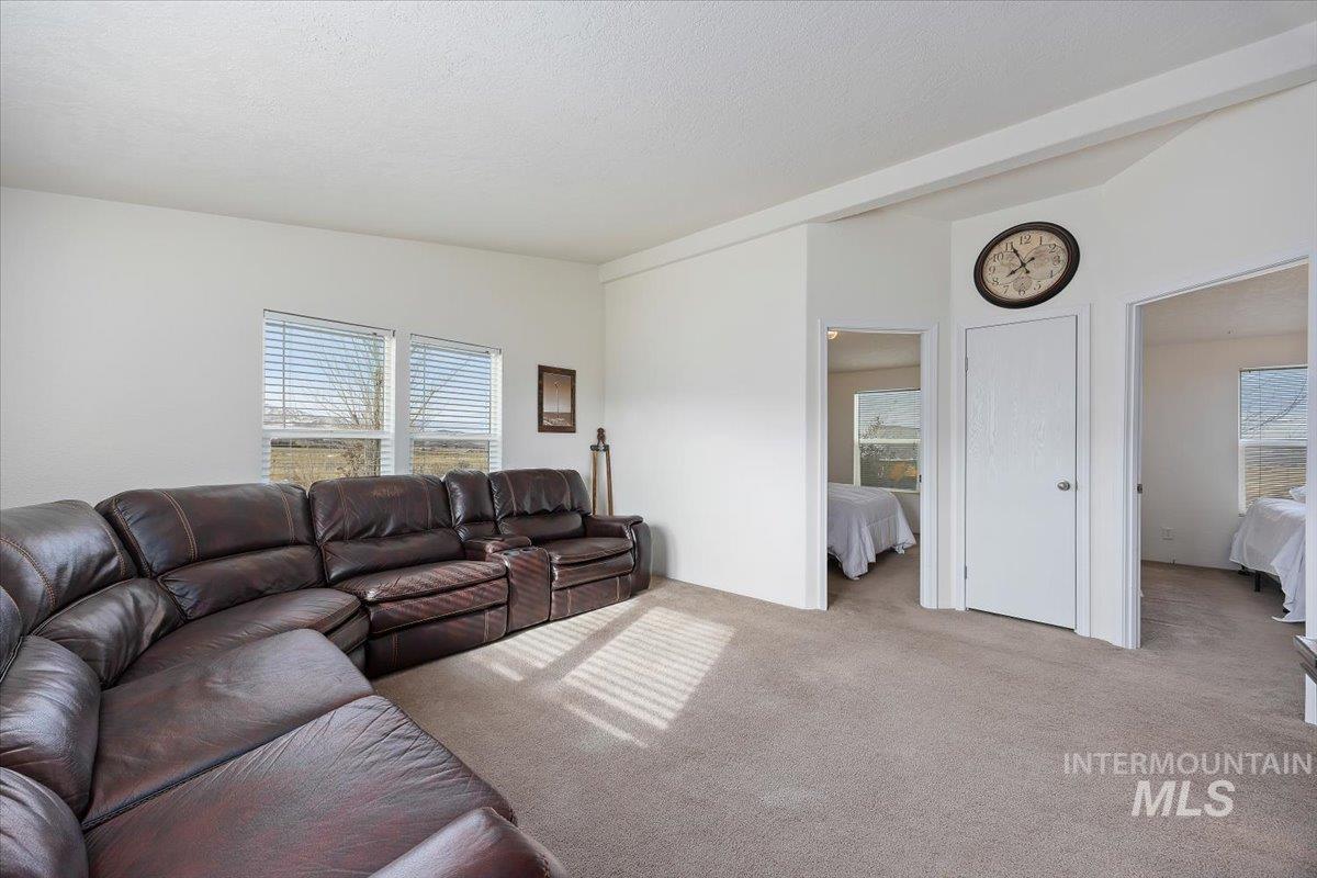 1014 S Highway Albion, ID 83311 - Photo 15 of 34 Carpeted living room featuring lofted ceiling