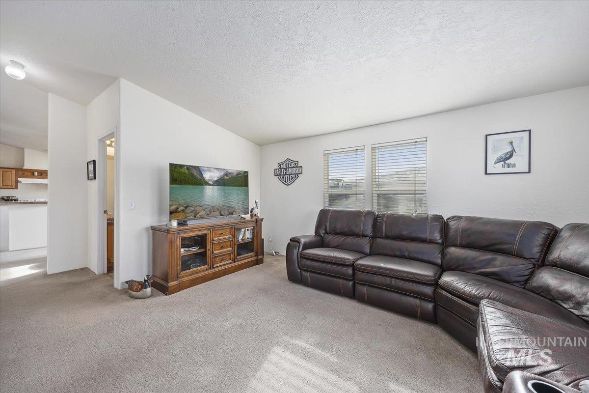 1014 S Highway Albion, ID 83311 - Photo 16 of 34 Living area featuring carpet flooring