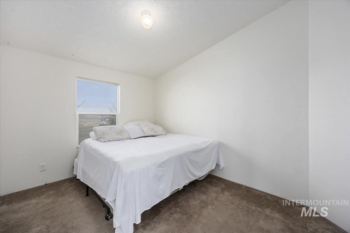 1014 S Highway Albion, ID 83311 - Photo 25 of 34 Carpeted bedroom featuring a textured wall