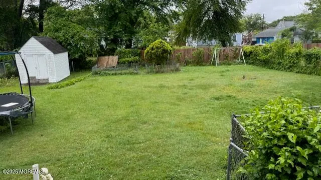 a backyard of a house with plants and outdoor seating