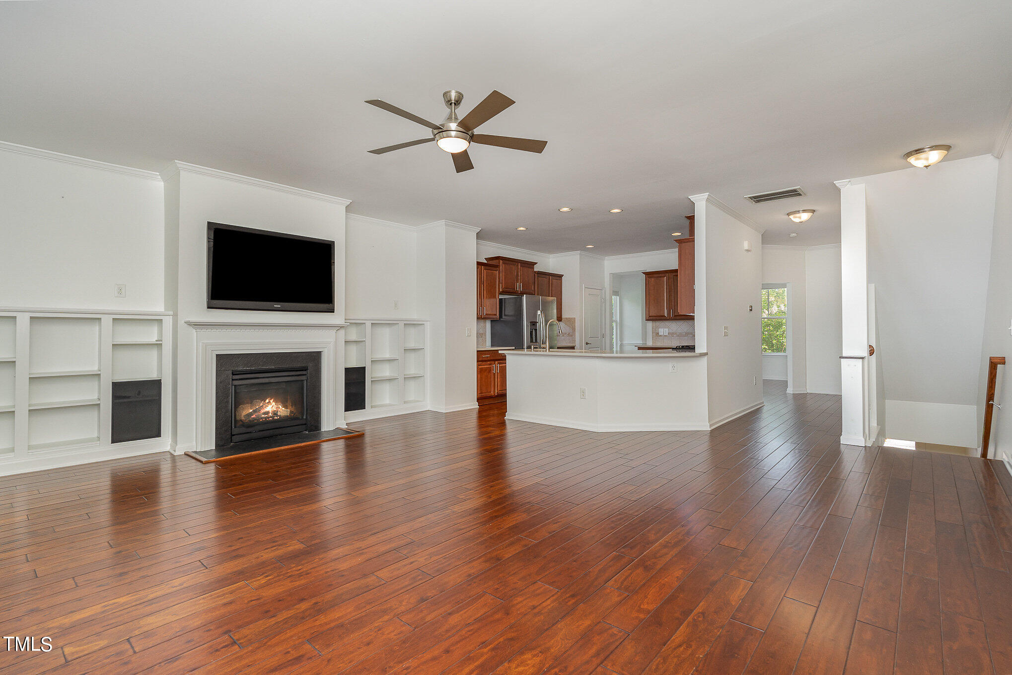 1435 Van Page Boulevard Raleigh, NC 27607 - Photo 21 of 41 a view of a kitchen with furniture a ceiling fan and wooden floor