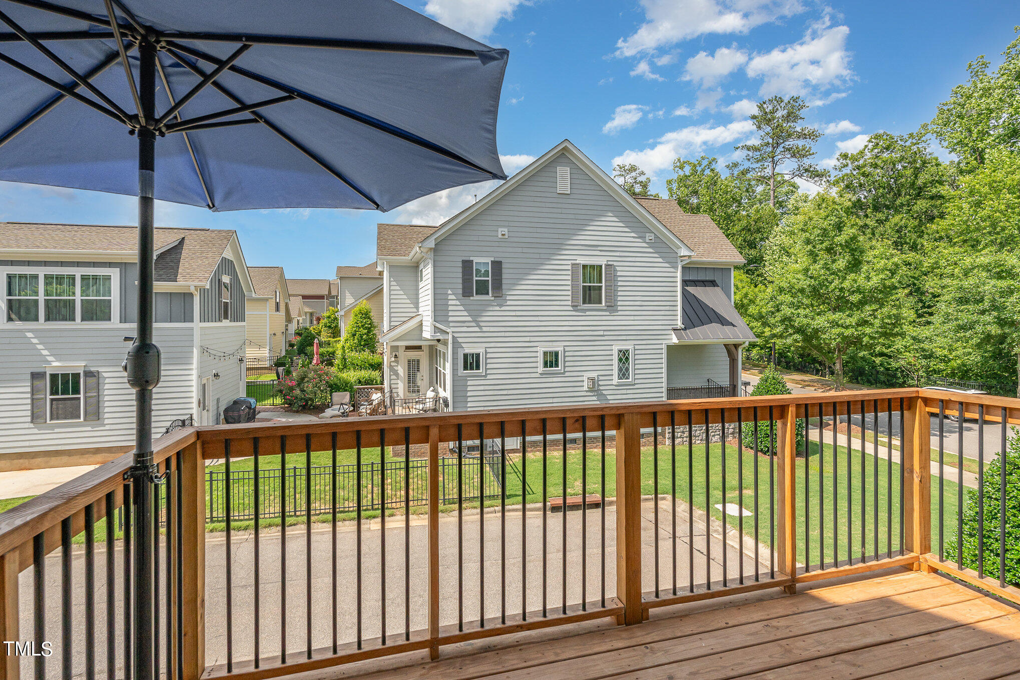 1435 Van Page Boulevard Raleigh, NC 27607 - Photo 23 of 41 a view of a house with a small yard and wooden fence