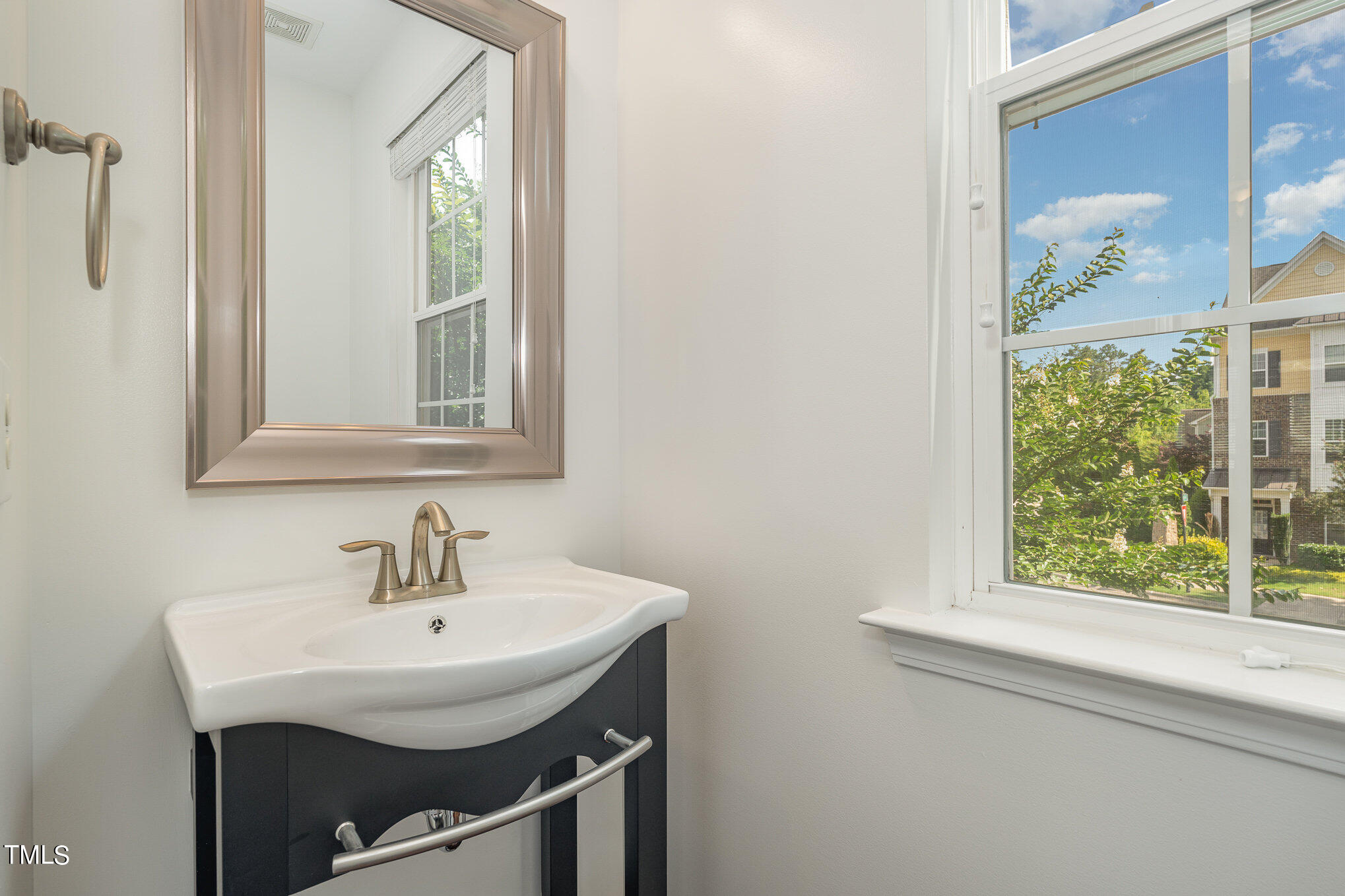 1435 Van Page Boulevard Raleigh, NC 27607 - Photo 24 of 41 a bathroom with a sink and a window