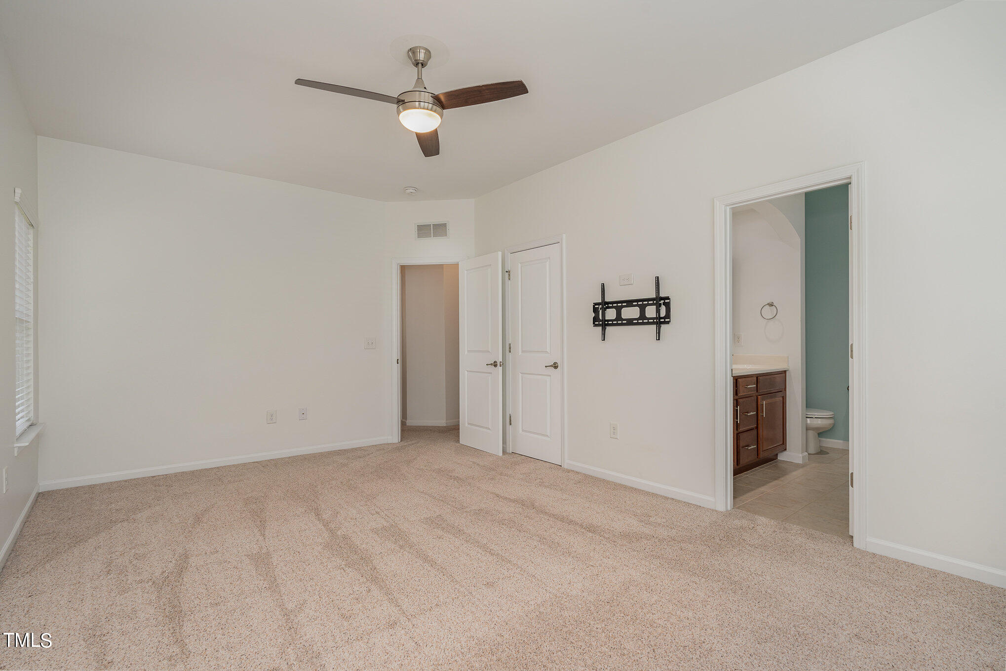 1435 Van Page Boulevard Raleigh, NC 27607 - Photo 26 of 41 an empty room with closet and windows