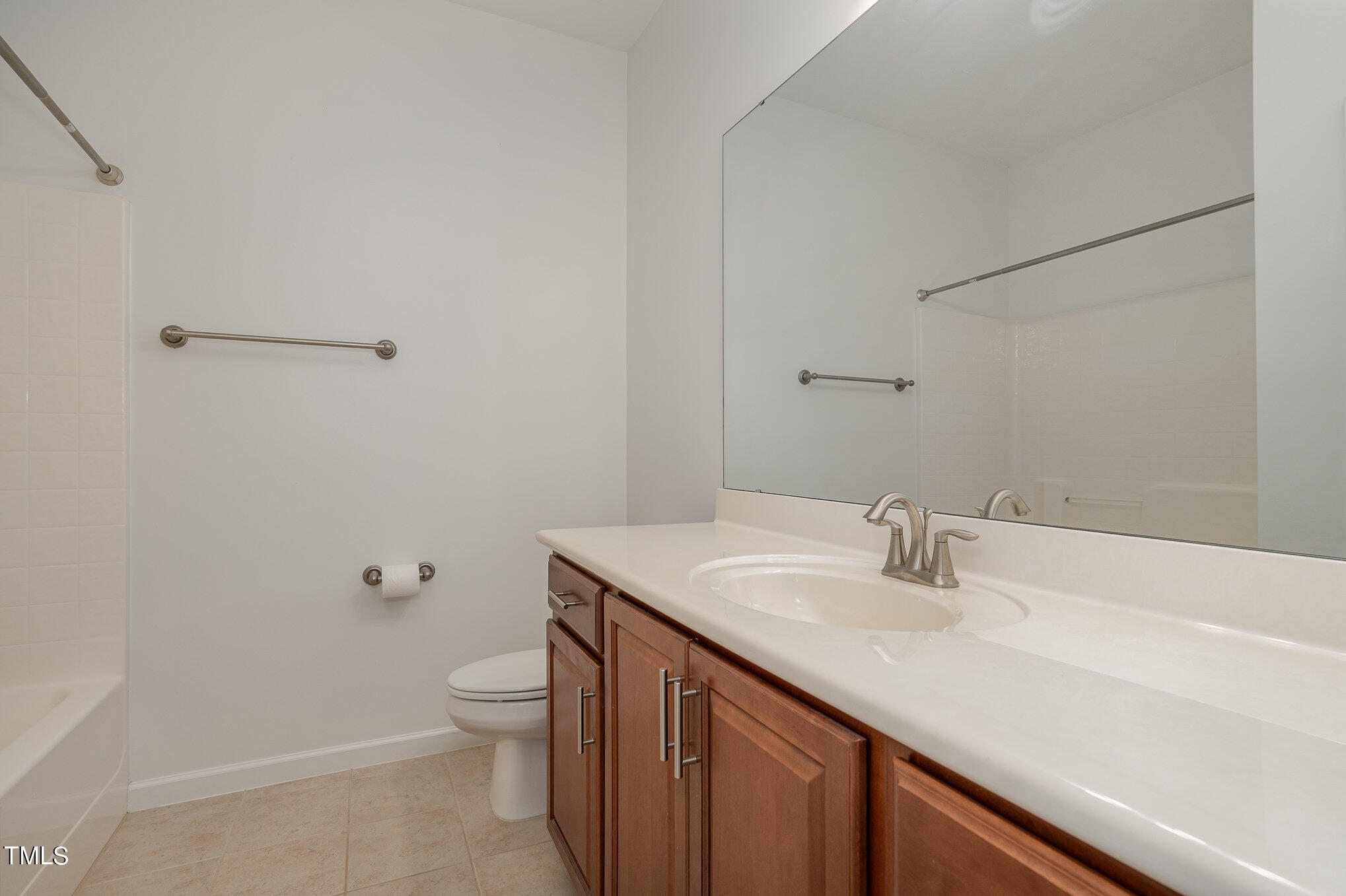1435 Van Page Boulevard Raleigh, NC 27607 - Photo 33 of 41 a bathroom with a sink a toilet and a mirror
