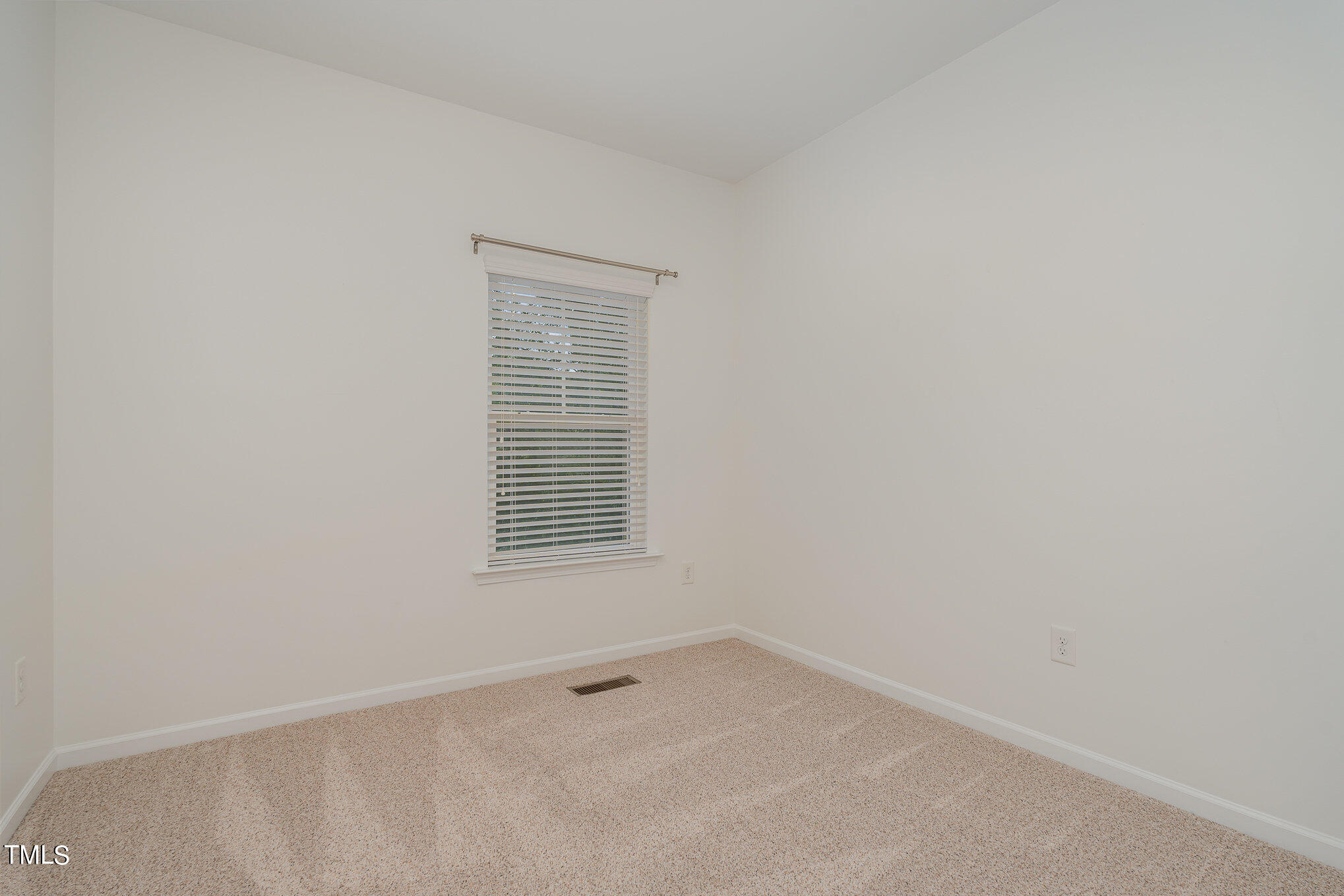 1435 Van Page Boulevard Raleigh, NC 27607 - Photo 34 of 41 a view of an empty room with a window
