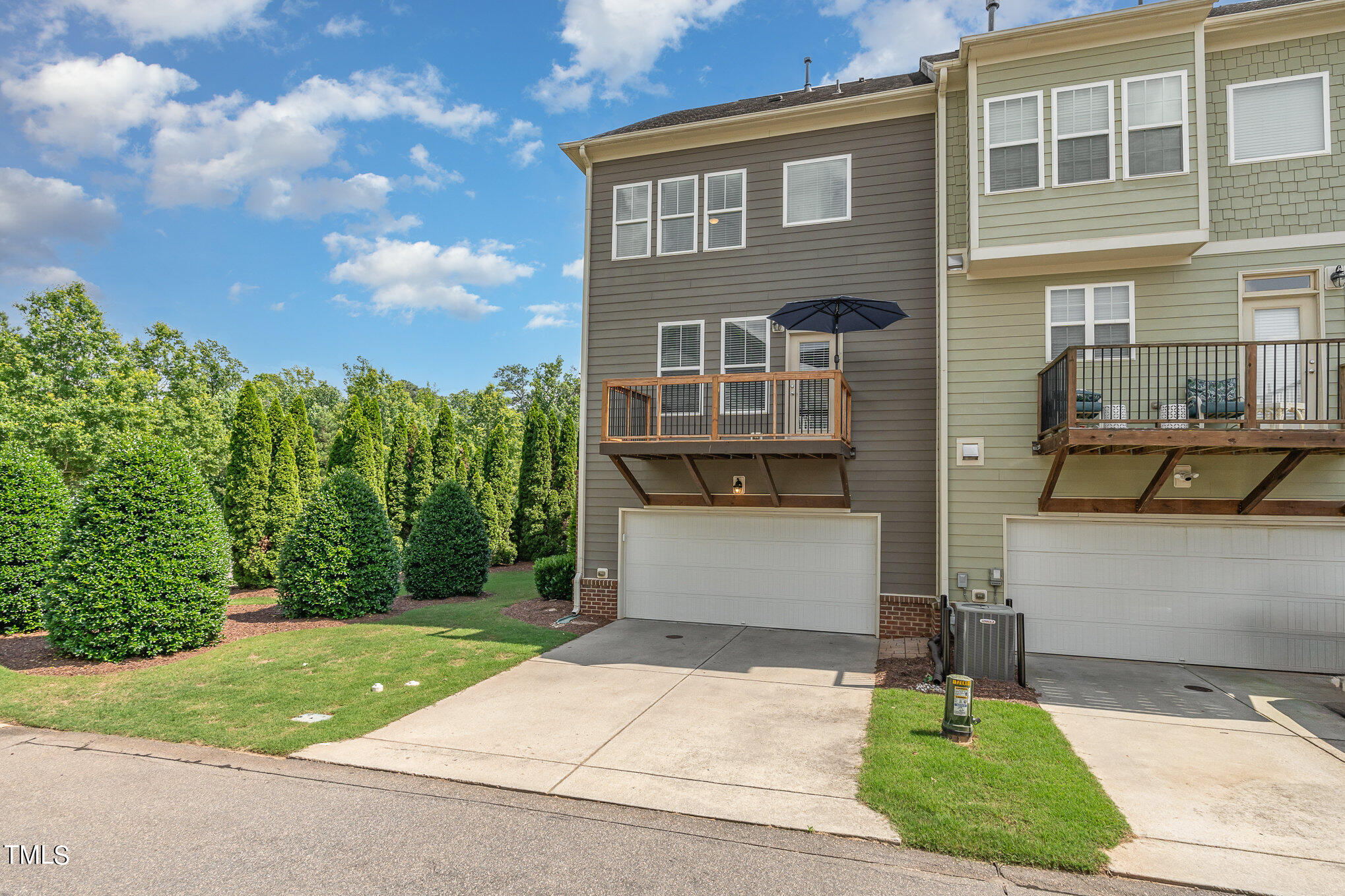 1435 Van Page Boulevard Raleigh, NC 27607 - Photo 5 of 41 a front view of a house with a yard