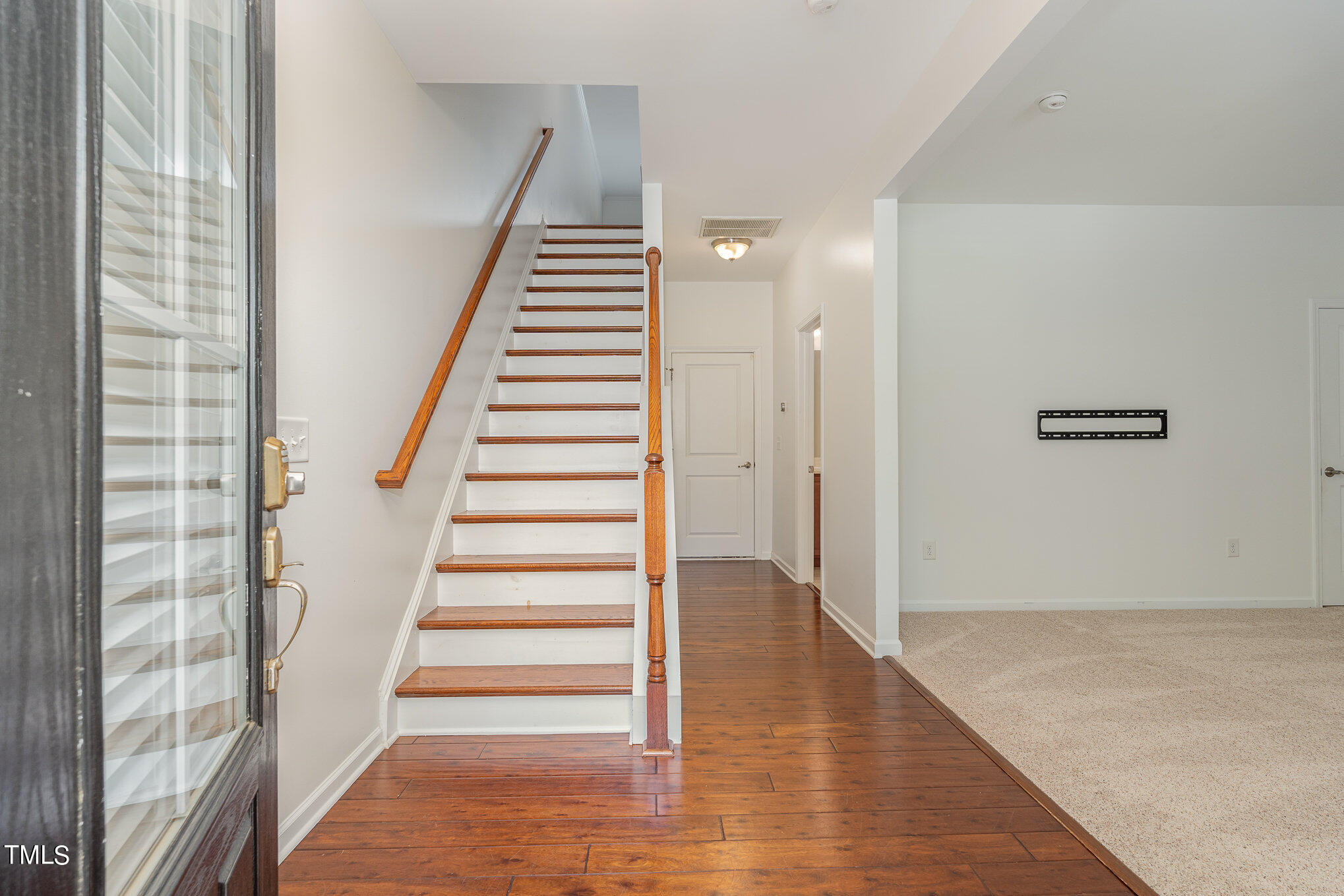 1435 Van Page Boulevard Raleigh, NC 27607 - Photo 9 of 41 a view of an entryway with wooden floor