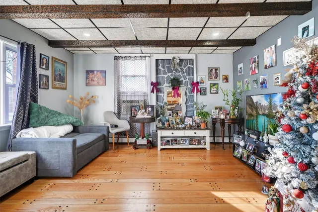 a living room filled with furniture and a chandelier