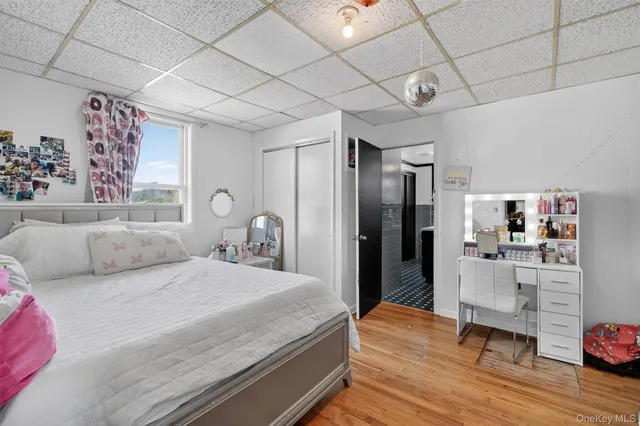 a bedroom with a bed and a desk