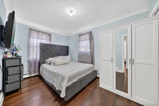 a bedroom with bed and window