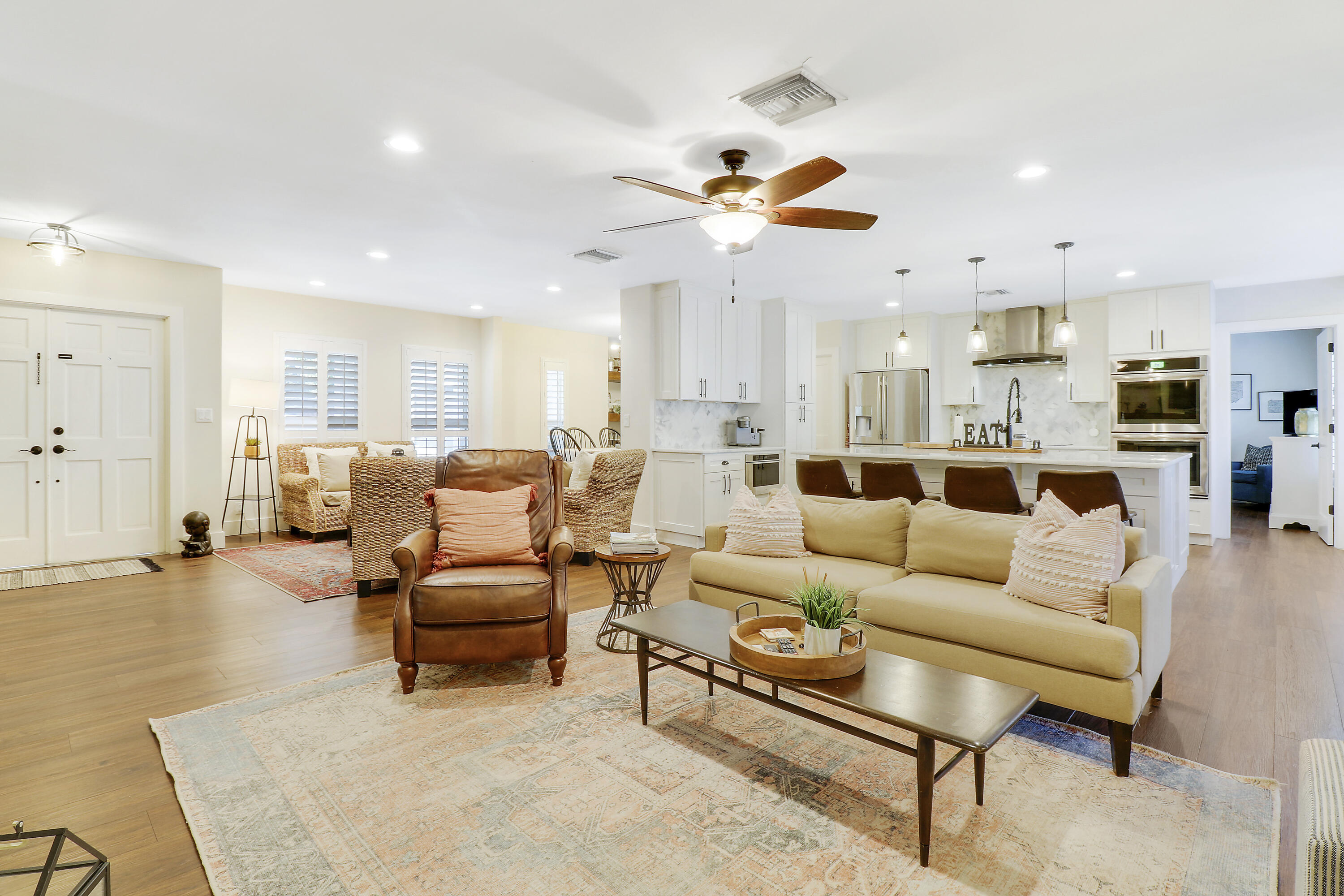 342 Country Club Drive Tequesta, FL 33469 - Photo 9 of 67 a living room with furniture kitchen view and a chandelier