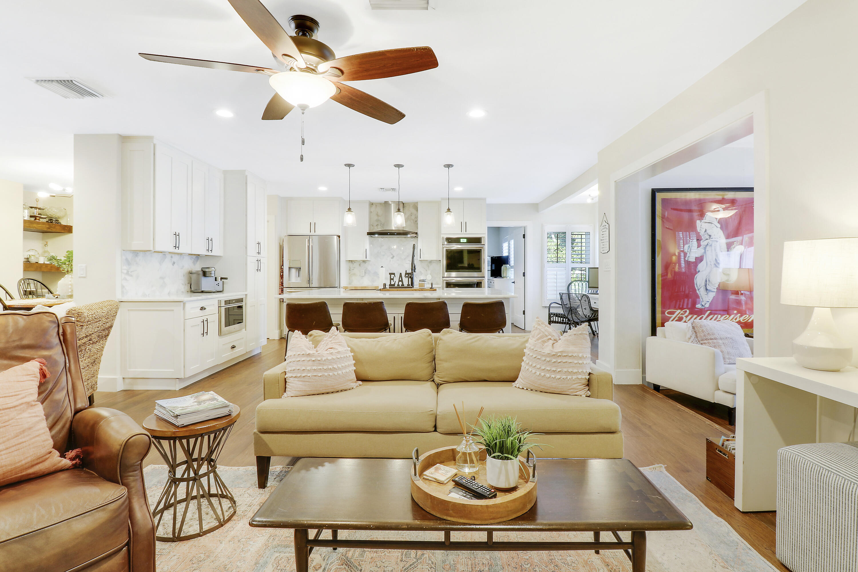342 Country Club Drive Tequesta, FL 33469 - Photo 10 of 67 a living room with furniture kitchen view and a chandelier