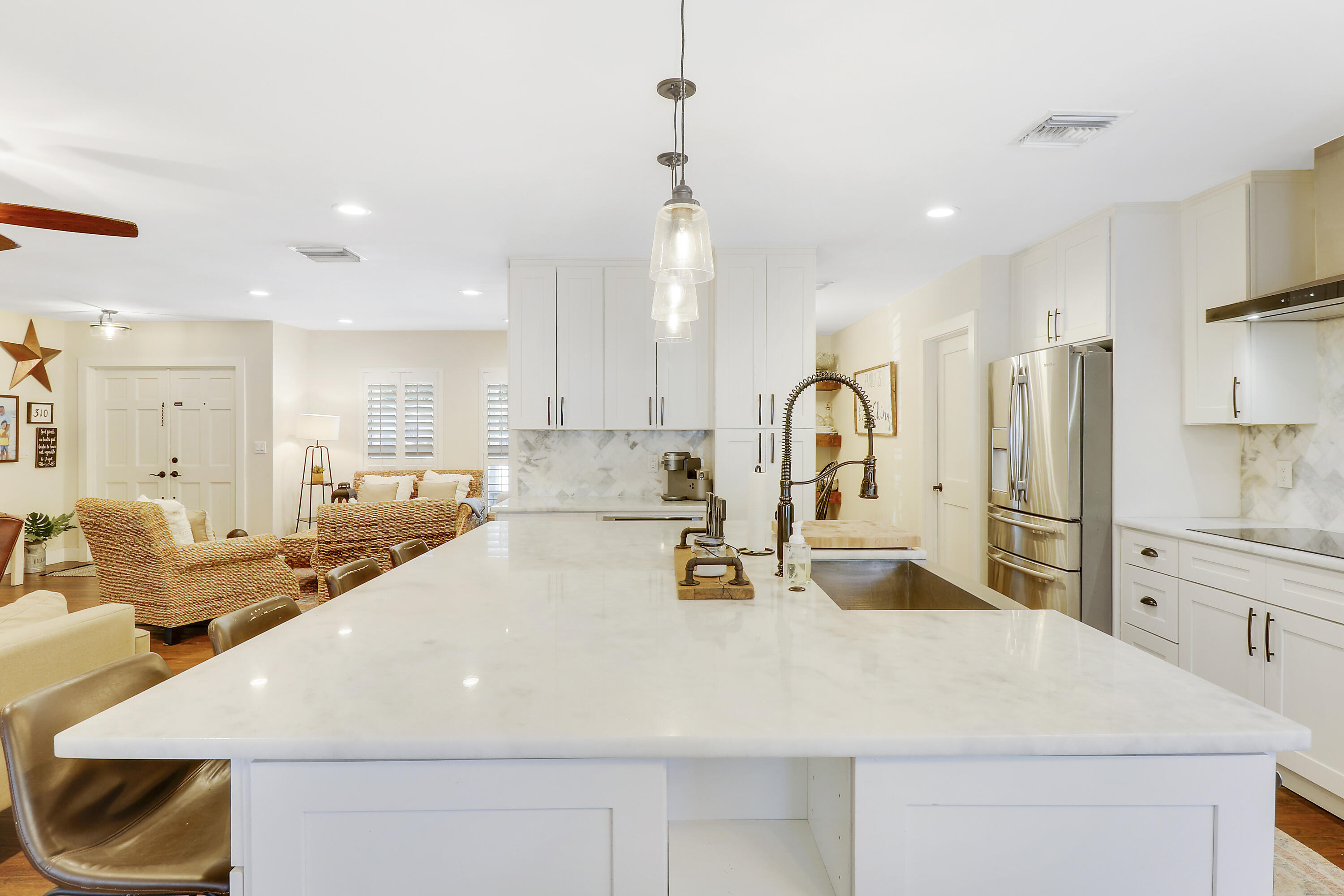 342 Country Club Drive Tequesta, FL 33469 - Photo 14 of 67 a large kitchen with a large counter top appliances and cabinets