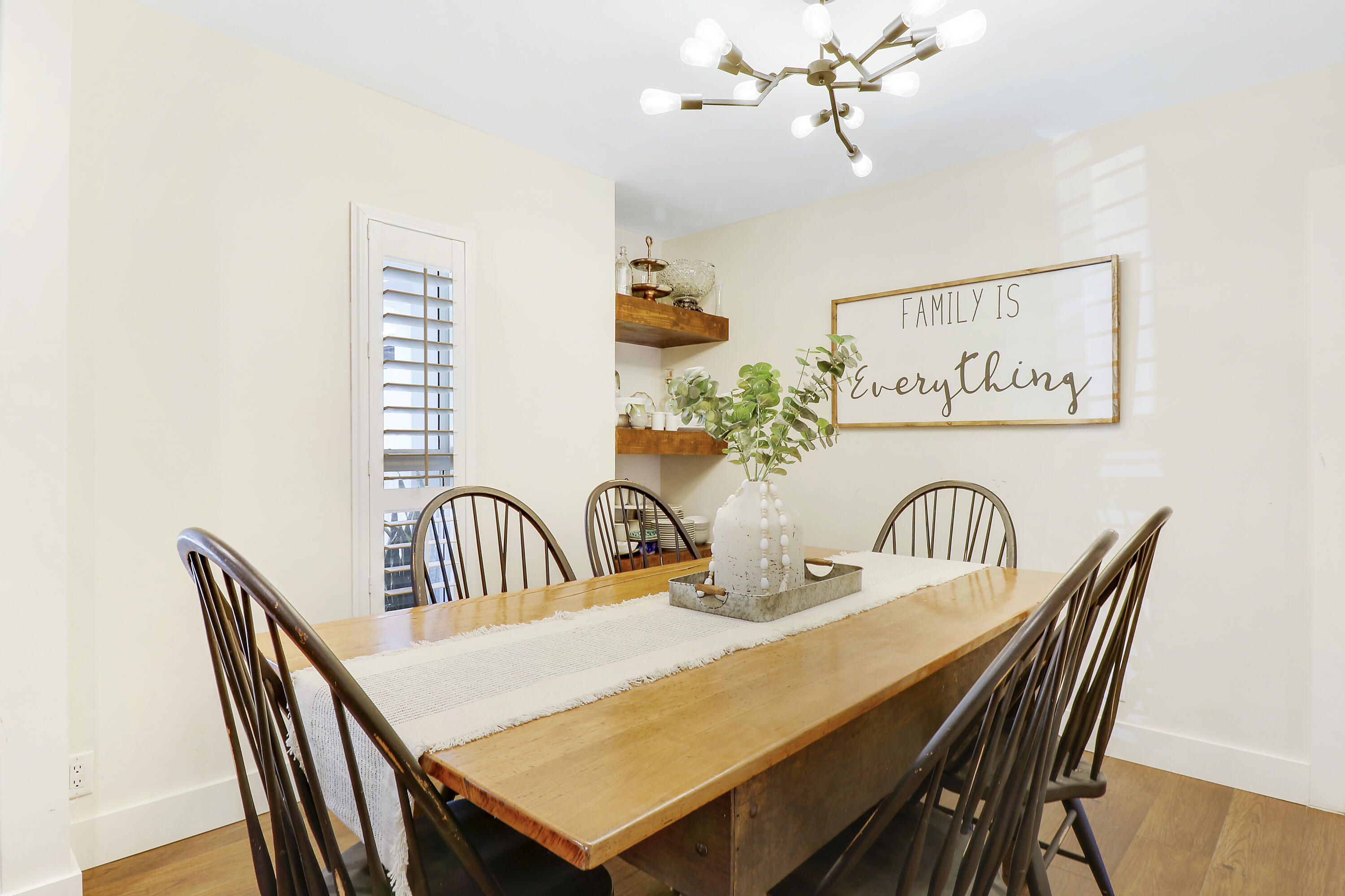342 Country Club Drive Tequesta, FL 33469 - Photo 20 of 67 a dining room with furniture and chandelier