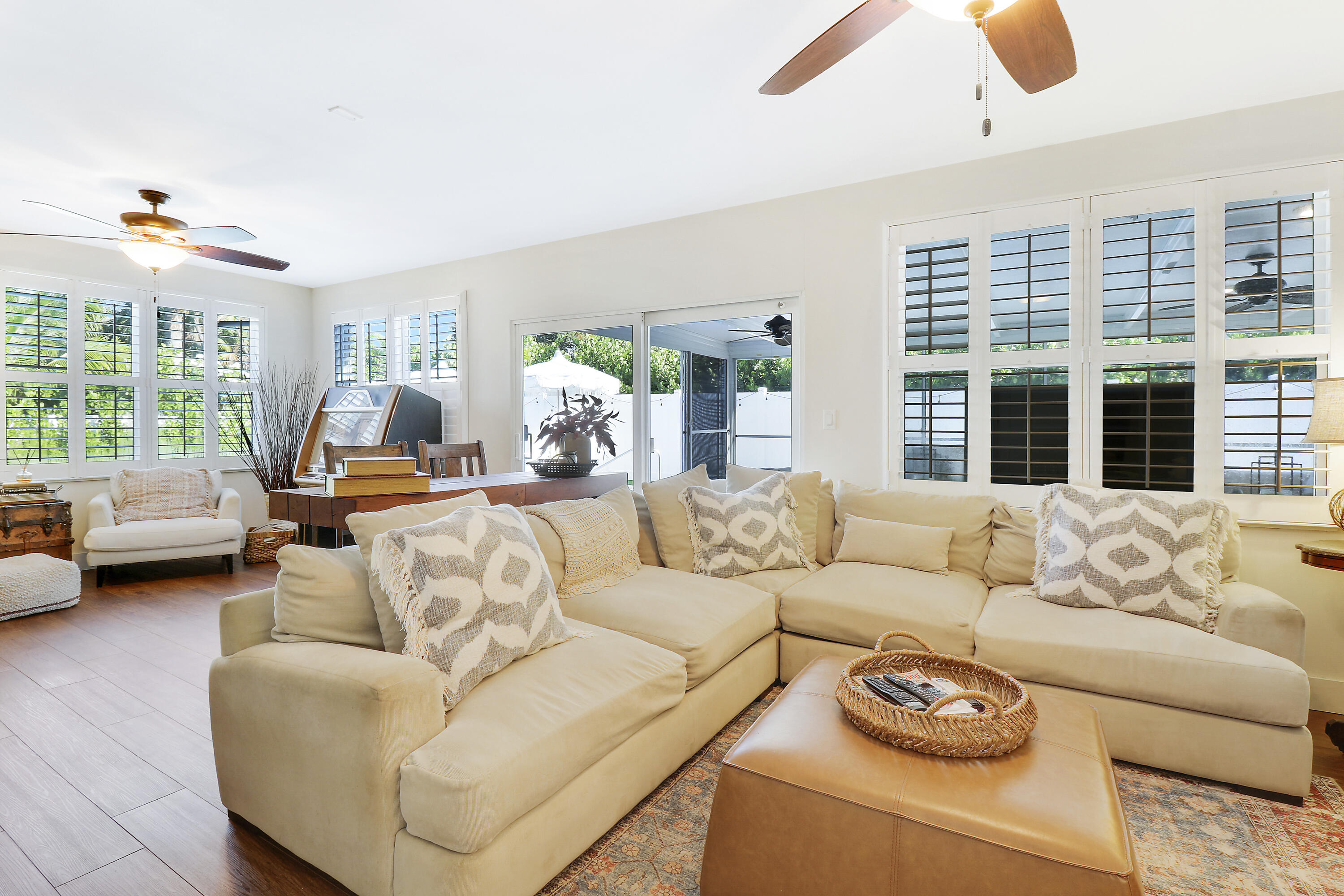 342 Country Club Drive Tequesta, FL 33469 - Photo 24 of 67 a living room with furniture and a large window