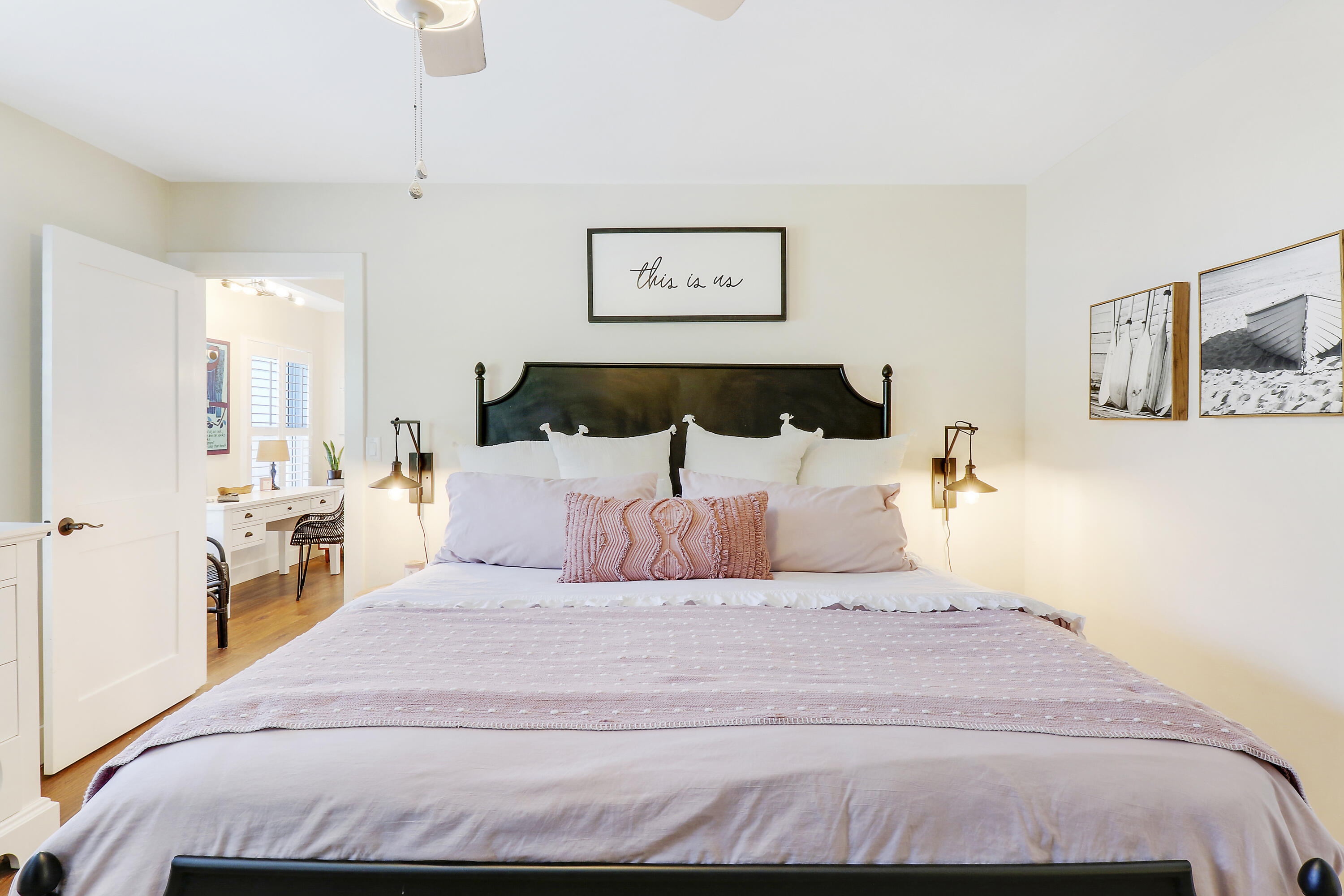 342 Country Club Drive Tequesta, FL 33469 - Photo 28 of 67 a bedroom with a large bed and a chandelier